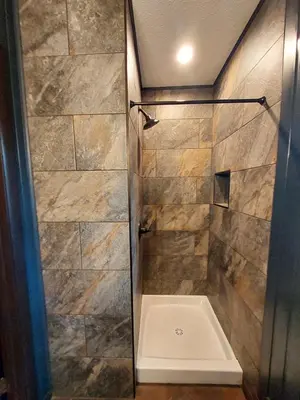 a shower with a glass door in a bathroom at Chalet renovated Near Casino, Camelback , Kalahari 4bdrms firepit hot tub game room in Tobyhanna