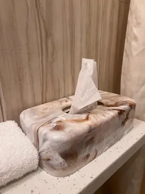a plastic container sitting on a table with a pillow at Grandview Hotel New York in Queens