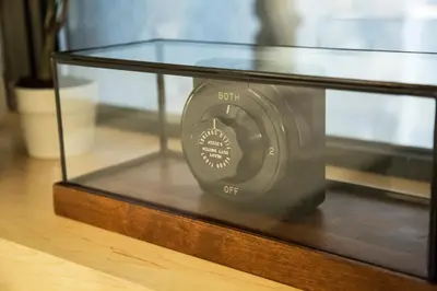 a glass table with a radio on top of it at Franklin Guesthouse in Brooklyn