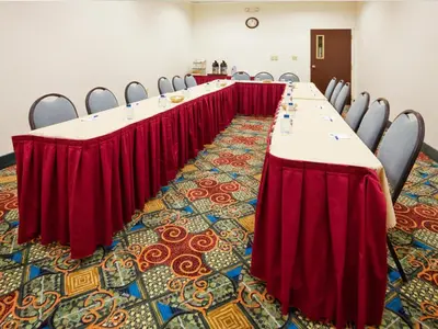 a row of tables in a room with chairs at Baymont by Wyndham East Windsor Bradley Airport in East Windsor