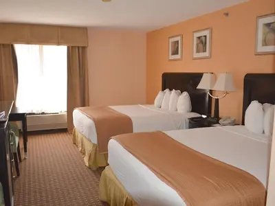 a hotel room with two beds and a window at Baymont by Wyndham East Windsor Bradley Airport in East Windsor