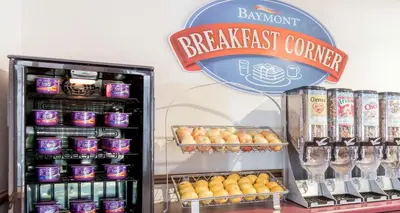 a bakery with a breakfast counter and a refrigerator at Baymont by Wyndham East Windsor Bradley Airport in East Windsor