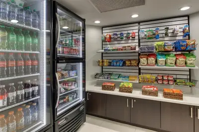 a refrigerator in a store filled with lots of drinks at Holiday Inn Express Fishkill-Mid Hudson Valley by IHG in Fishkill