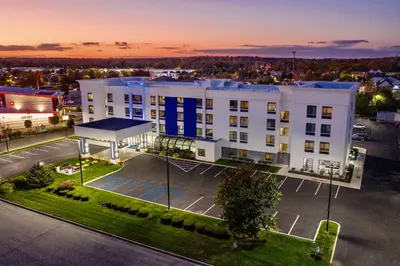 an aerial view of a building with a parking lot at Holiday Inn Express Fishkill-Mid Hudson Valley by IHG in Fishkill