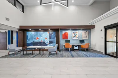 an office lobby with chairs and a table at Holiday Inn Express Hotel & Suites West Point-Fort Montgomery by IHG in Fort Montgomery