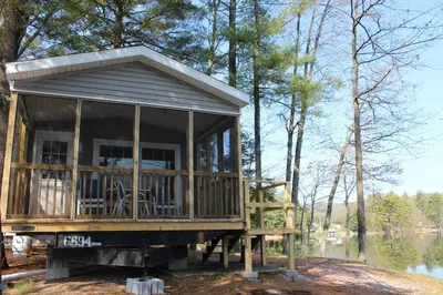 a tiny house on the back of a truck at Alpine Lake Lakefront Park Model 4 in South Corinth