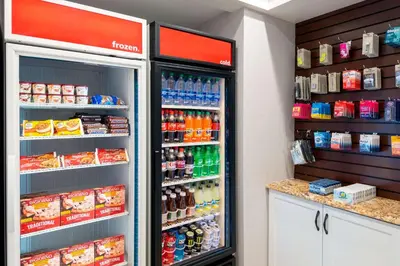 a refrigerator in a store with lots of drinks at Hampton Inn and Suites Hartford/Farmington in Farmington