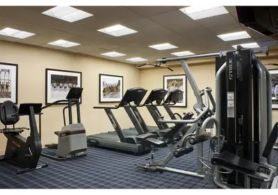a gym with treadmills and cardio equipment in a room at New Haven Hotel in New Haven