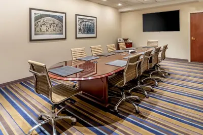 a conference room with a long table and chairs at New Haven Hotel in New Haven