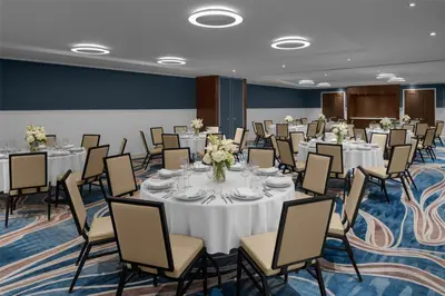 a conference room with round tables and chairs at Hilton Brooklyn New York - Newly Renovated in Brooklyn
