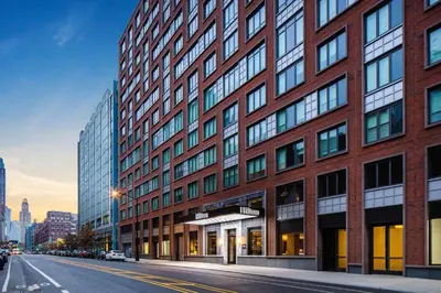 a tall red brick building on a city street at Hilton Brooklyn New York - Newly Renovated in Brooklyn