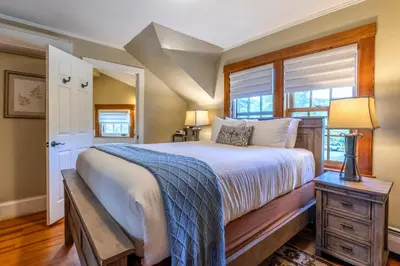 a bedroom with a large bed and a window at The White House Inn in Wilmington