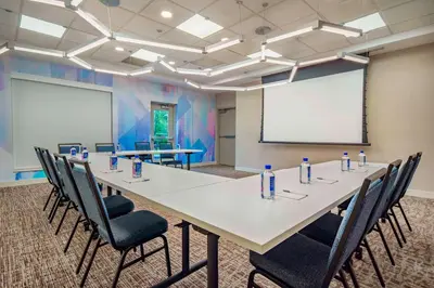 a conference room with a large table and chairs at Hilton Garden Inn Danbury in Danbury