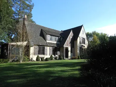 a house with a large yard with green grass at The Stables in Kingston
