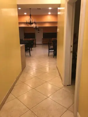 a hallway with a dining room and a dining table at The Sunview Motel in Tannersville