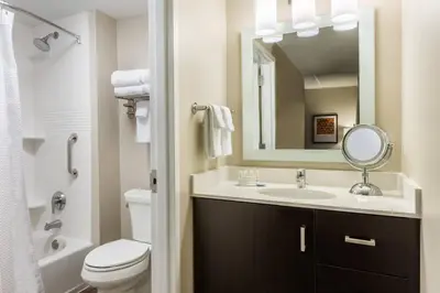 a bathroom with a sink and a mirror at TownePlace Suites by Marriott Latham Albany Airport in Latham
