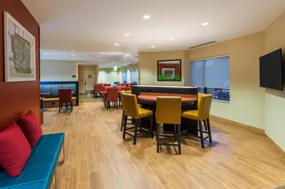a dining room with a table and chairs at TownePlace Suites by Marriott Latham Albany Airport in Latham
