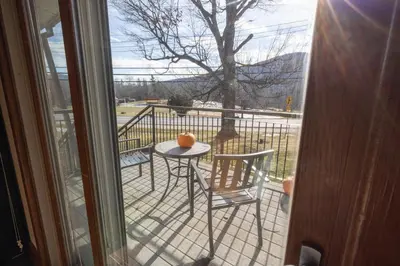an orange sitting on a table on a balcony at Winwood Condominiums by Windham Mountain Club in Windham