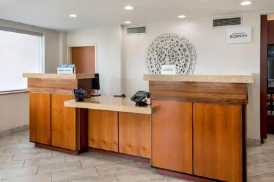 a lobby with a reception desk with a phone at Fairfield Inn by Marriott New York LaGuardia Airport/Flushing in Queens
