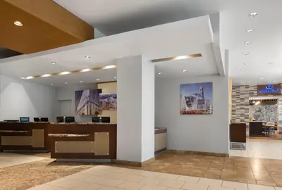 a lobby with a reception desk in a building at DoubleTree by Hilton Hartford Downtown in Hartford