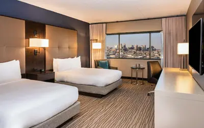 a hotel room with two beds and a television at DoubleTree by Hilton Hotel Newark Airport in Newark