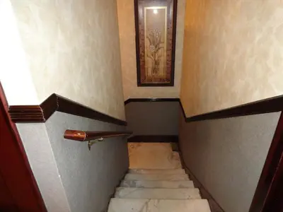 a staircase in a building with a picture on the wall at Hotel 31 Extended Stay in New York