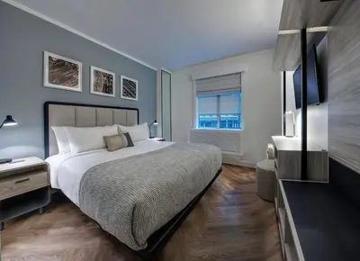 a bedroom with a large bed and a television at Citadines Connect Fifth Avenue New York in New York