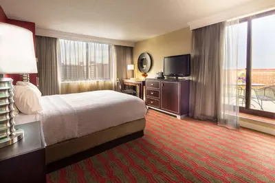 a hotel room with a bed and a television at DoubleTree by Hilton New York-LaGuardia in Queens