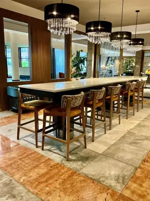 a dining room with a large table and chairs at DoubleTree by Hilton New York-LaGuardia in Queens