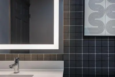 a bathroom with a sink and a mirror at Ardsley Acres Hotel Court in Ardsley