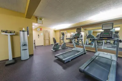 a gym with treadmills and elliptical machines at Hotel MTK Mount Kisco in Mount Kisco