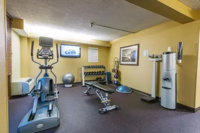 a gym with exercise equipment in a room at Hotel MTK Mount Kisco in Mount Kisco