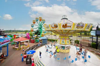 an amusement park with a carnival ride and a roller coaster at Holiday Inn Plainview-Long Island by IHG in Plainview