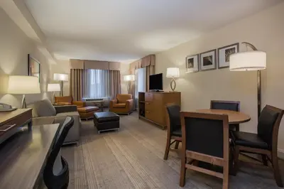 a hotel room with a living room at Holiday Inn Saratoga Springs by IHG in Saratoga Springs