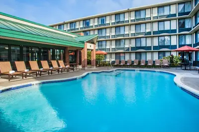 a swimming pool in front of a hotel at Holiday Inn Saratoga Springs by IHG in Saratoga Springs