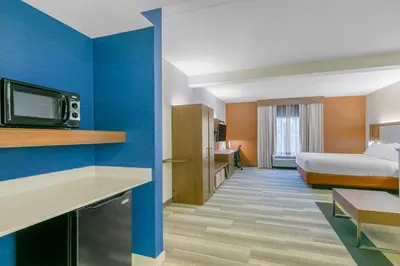 a hotel room with a bed and a tv at Holiday Inn Express Mount Arlington by IHG in Mount Arlington