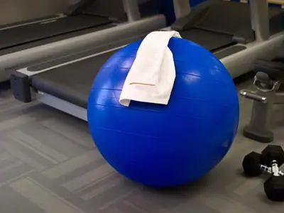 a blue gym ball with a towel on it at Homewood Suites by Hilton Parsippany-Troy Hills in Parsippany