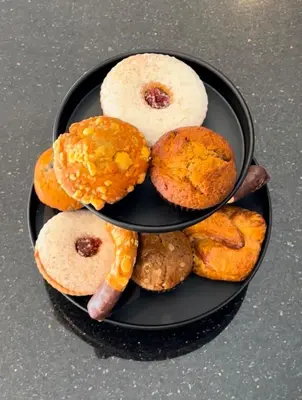 a plate of different types of donuts on a table at Moderne Hotel in New York