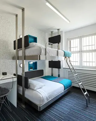 a bunk bed room with two bunk beds in it at Pod 51 in New York