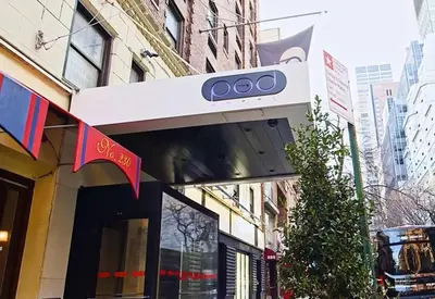 a store with a sign on the front of a building at Pod 51 in New York