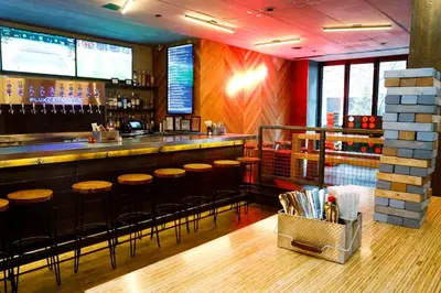 a bar with bar stools in a restaurant at Pod 51 in New York