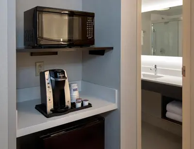 a bathroom with a microwave and a coffeemaker at Holiday Inn Express Great Barrington by IHG in Great Barrington