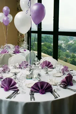 a table with purple and white balloons on it at Holiday Inn & Suites Pittsfield-Berkshires by IHG in Pittsfield
