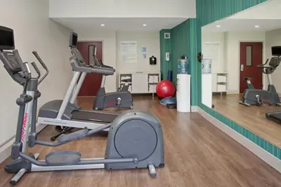 a gym with treadmills and a treadmill at Holiday Inn Express Haskell-Wayne Area by IHG in Haskell