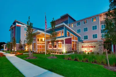 a building with an american flag in front of it at Residence Inn by Marriott Kingston in Kingston