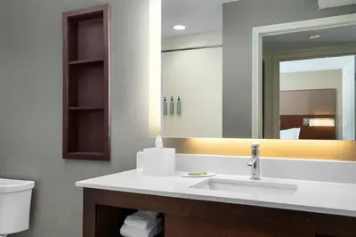 a bathroom with a sink and a mirror at Residence Inn by Marriott Kingston in Kingston
