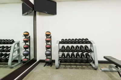 a gym with a rack of dumbbells at Homewood Suites by Hilton Holyoke-Springfield/North in Holyoke