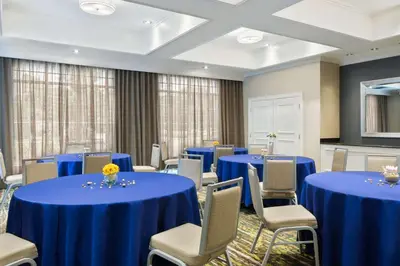 a conference room with blue tables and chairs at Homewood Suites by Hilton Holyoke-Springfield/North in Holyoke