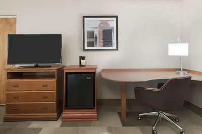 an office with a desk with a television and a chair at Hampton Inn Danbury in Danbury