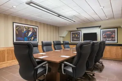 a conference room with a wooden table and chairs at Hampton Inn Danbury in Danbury
